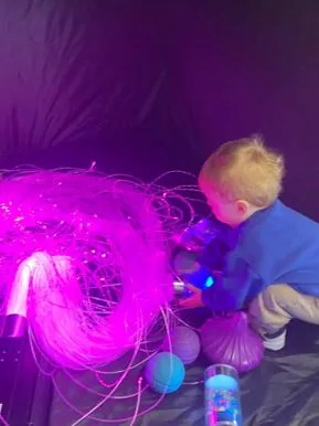Nursery child playing with sensory toys