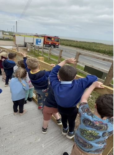 Nursery children watching fire engine