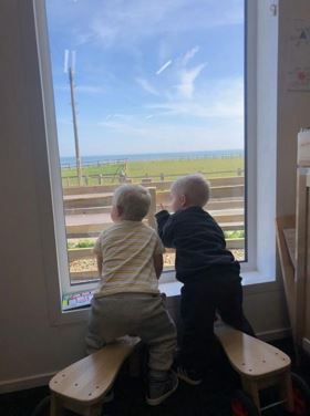 Nursery children looking out the window